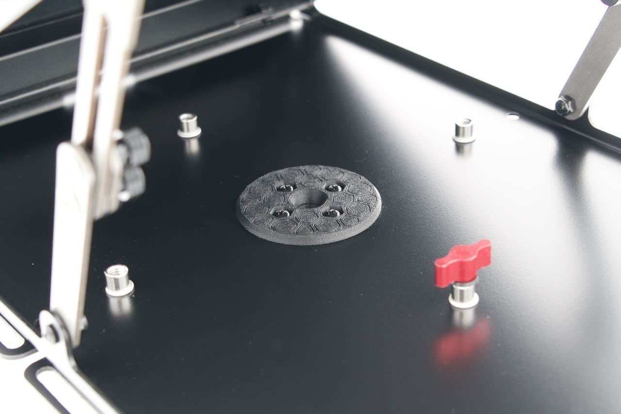 Inside view of Tuff Mount for Starlink Mini, showing cord port and adjuster screw