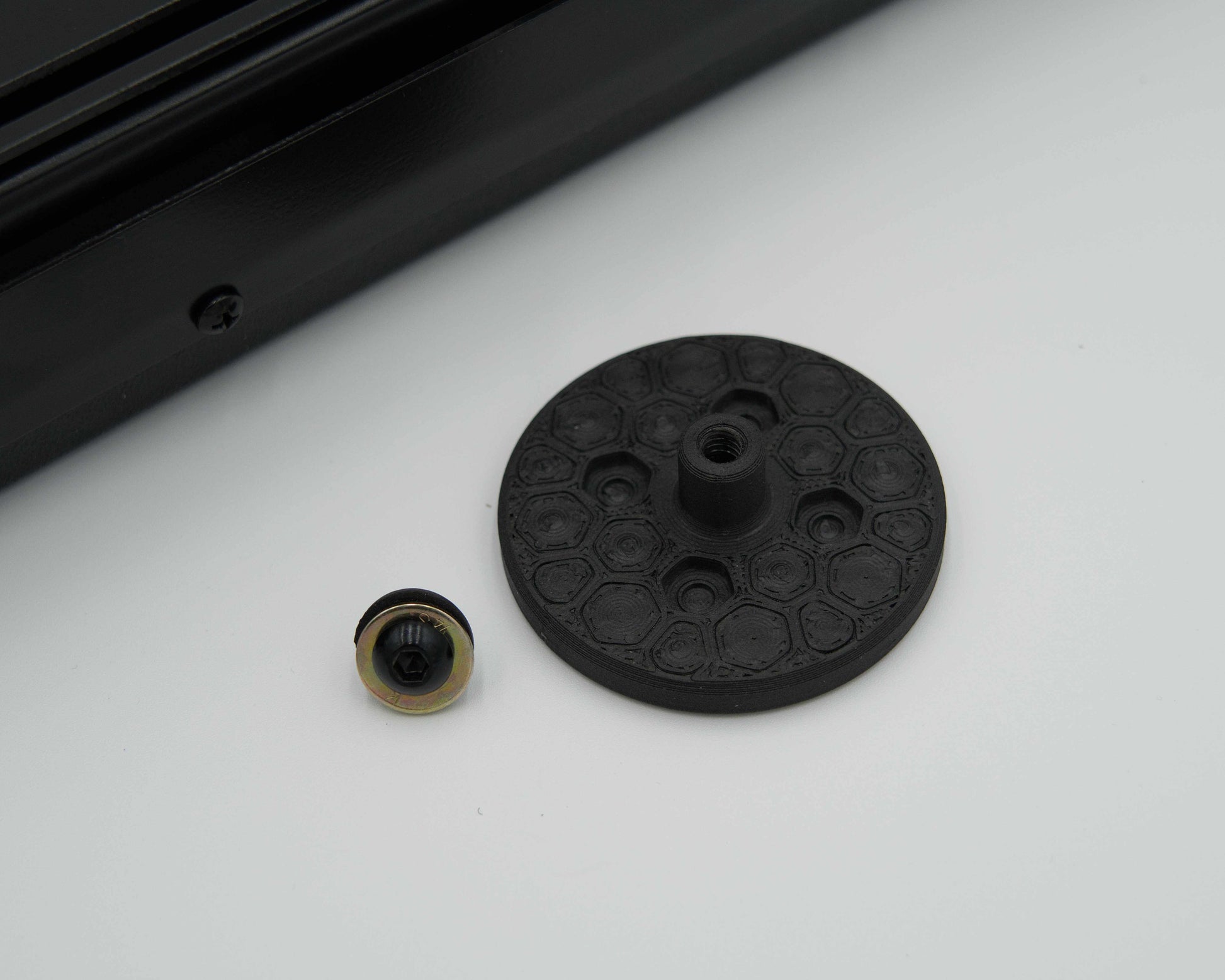 Close-up of Tuff Mount Tripod adapter, Shown with screw and adapter. 