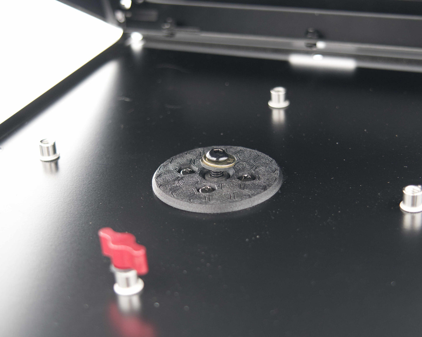Close-up of the Tuff Mount Tripod adapter from the inside of the Tuff Mount. Showing how it is secured. 