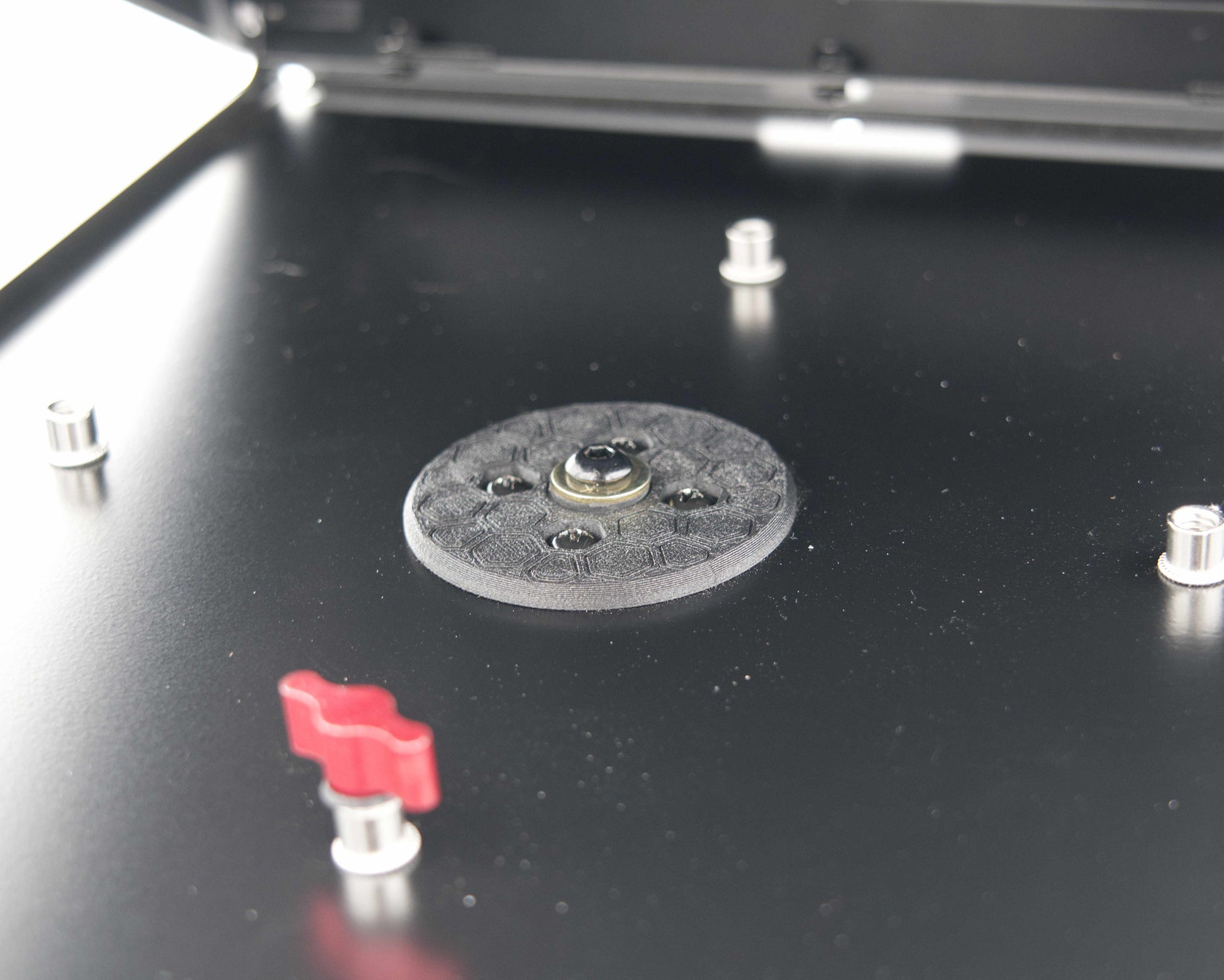 Close-up of the Tuff Mount Tripod Adapter on the inside of the Tuff Mount. Showing the fastener securely tightened. 