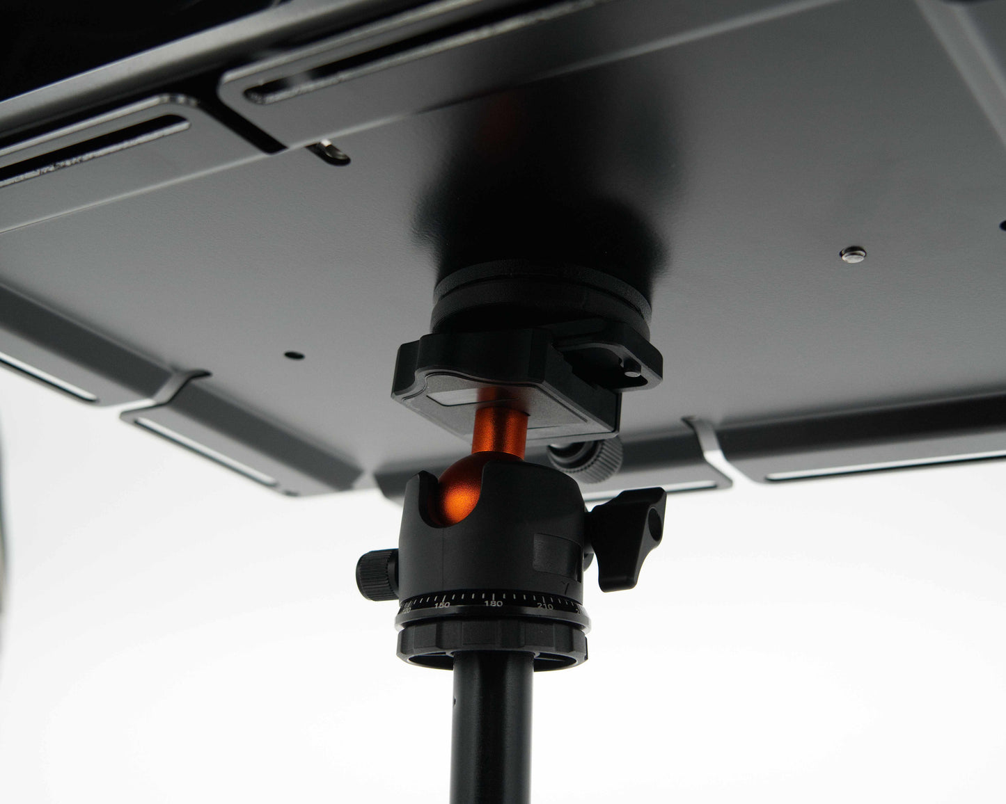 Tripod adapter for Tuff Mount shown from below on top of a tripod. 
